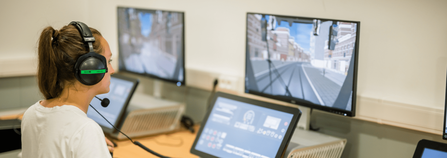Tram driver in training on a Nano Simulator at STIB, simulating different tram models in a realistic environment.