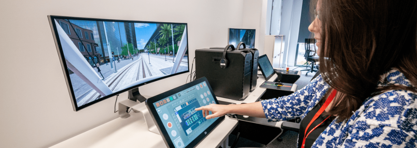 Transdev tram driver using a Nano Simulator with a curved screen for enhanced immersion.